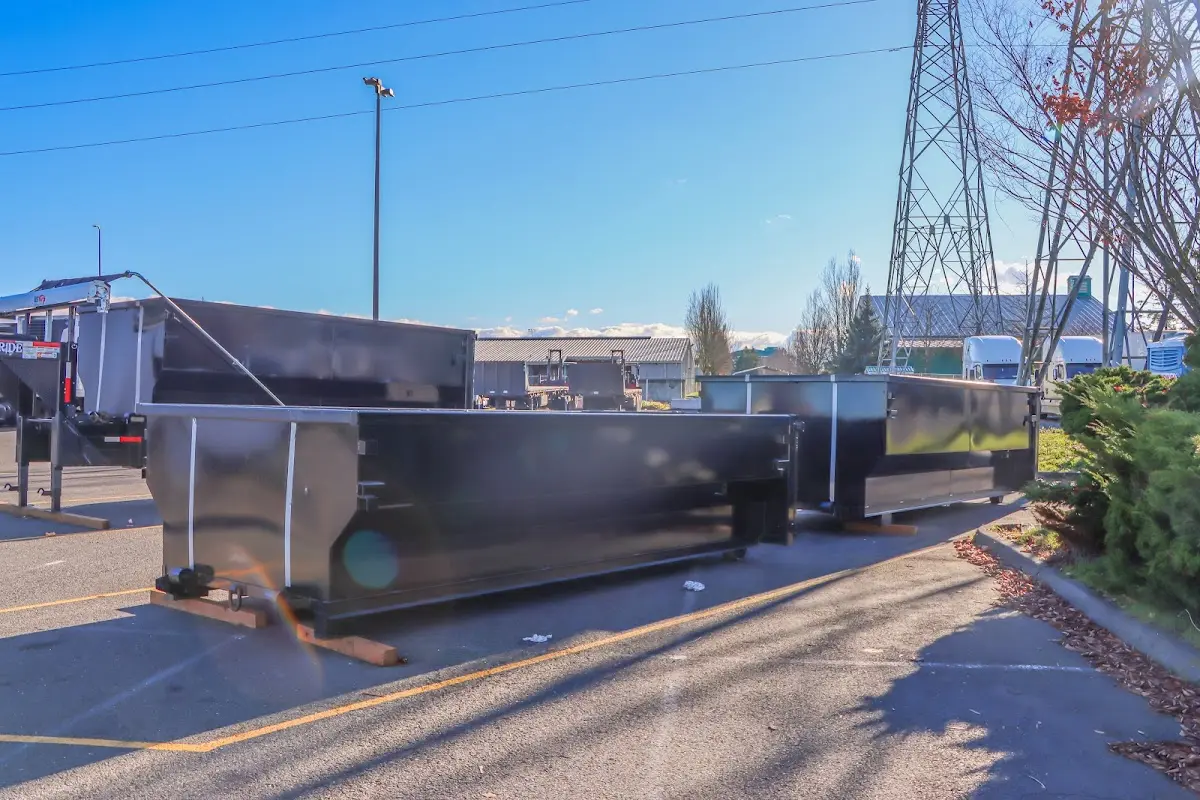 Roll-off dumpster ready for waste disposal at job site for 2 Yard Dumpster Rental in Millington